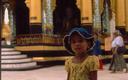 Very cute little girl all dressed up for her visit to Bagos main temple.